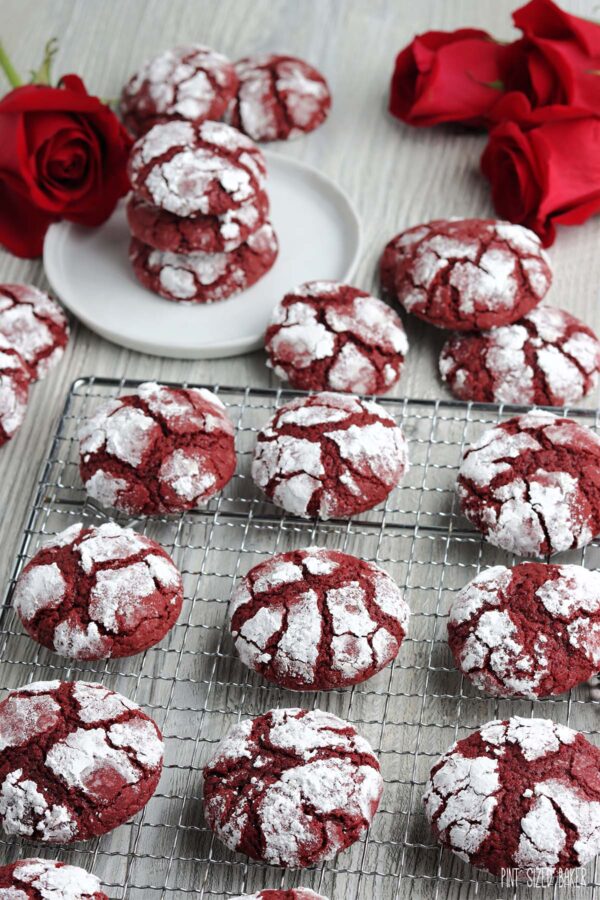 Crinkle Cookies on a cooling rack with powdered sugar.